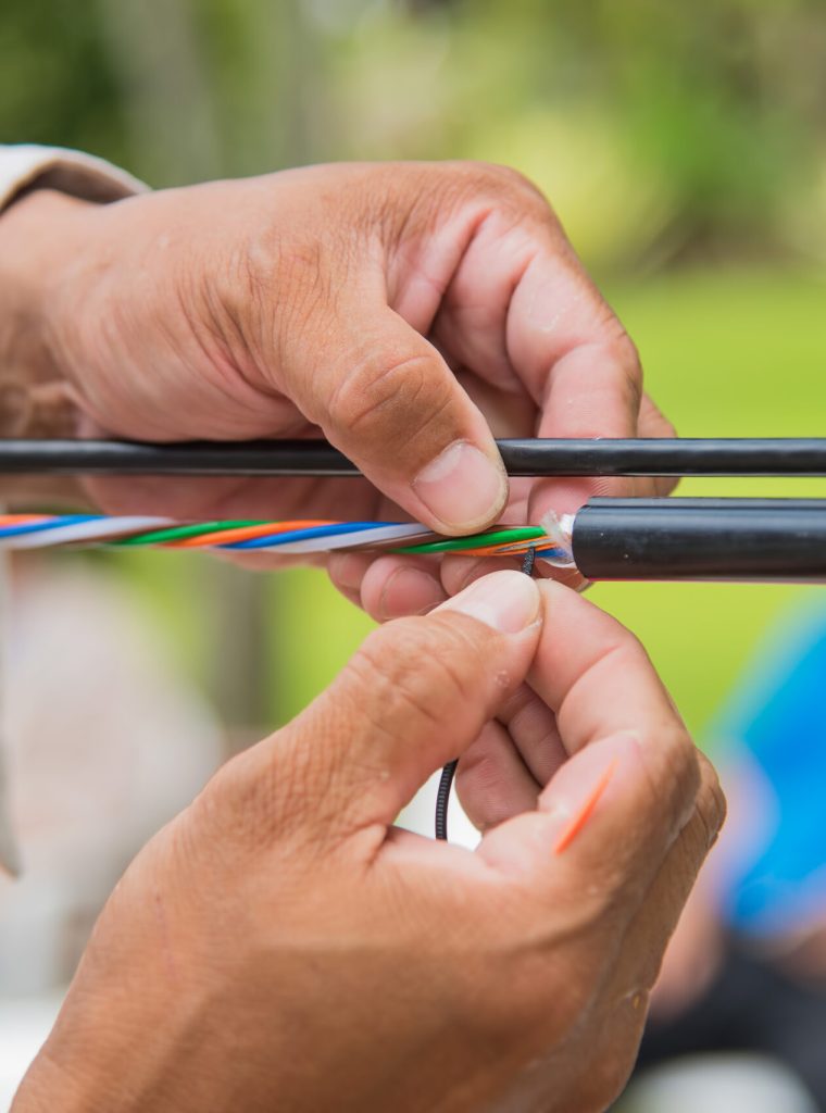 Technicians are installing optic fiber.